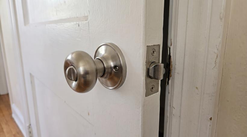 The same door with new hardware fitted and aligned