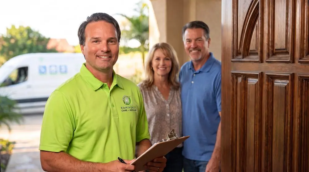 Kaminskiy technician greeting homeowners at their front door