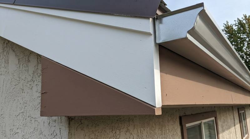 The same corner rebuilt with sound wood, primed and sealed