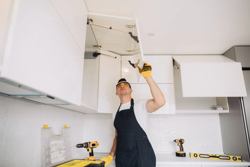 Handyman Installing Kitchen Cabinets with safety g 2026, 03, 19, 02, 11, 56 utc